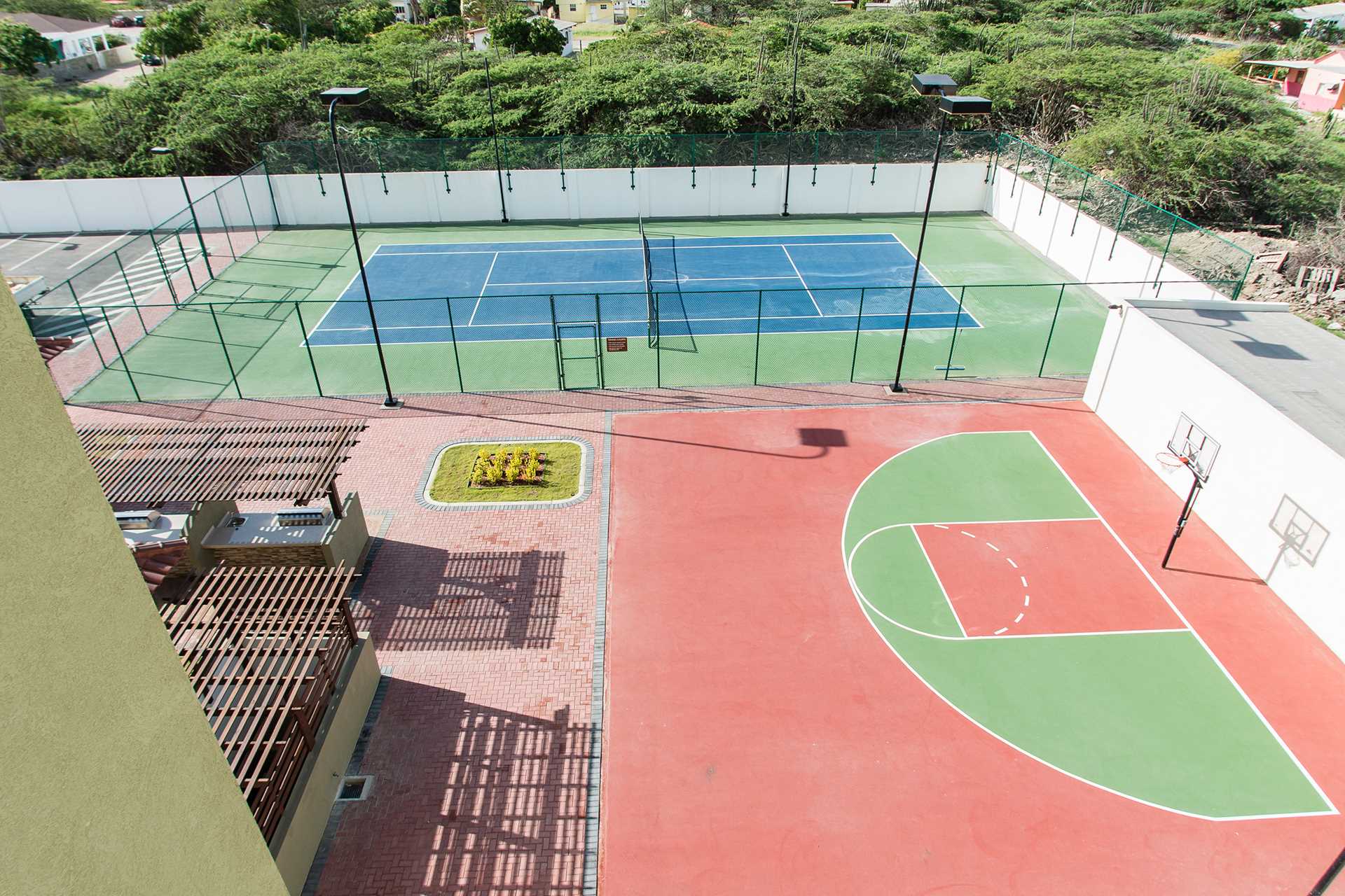 Hard surface tennis court and half basketball court availabl