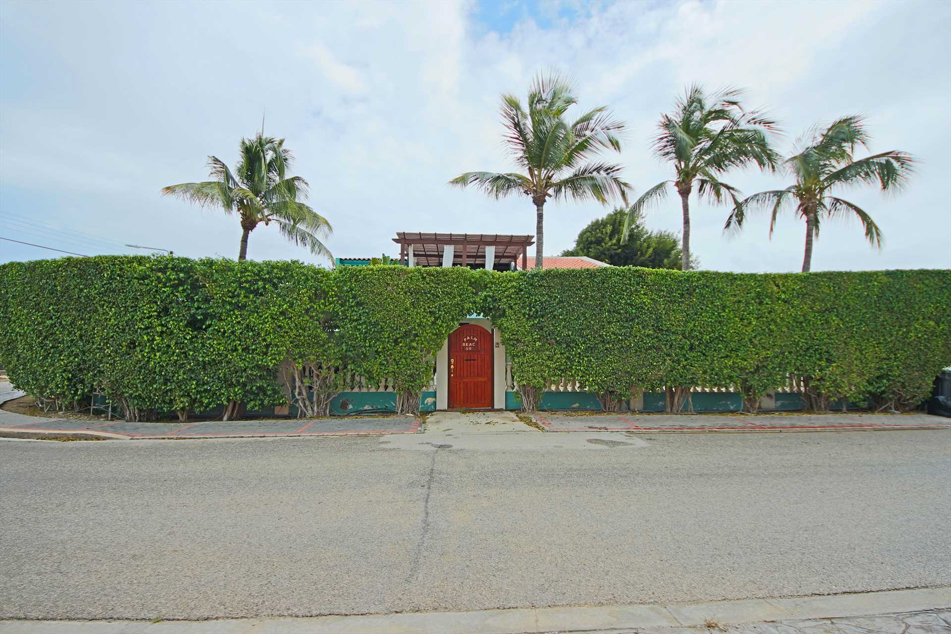 The Palm Beach Fortress  has 12-feet high hedges surrounding