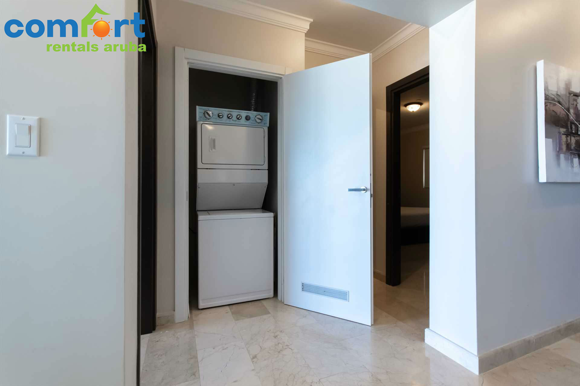 Washer and dryer are conveniently located in the condo
