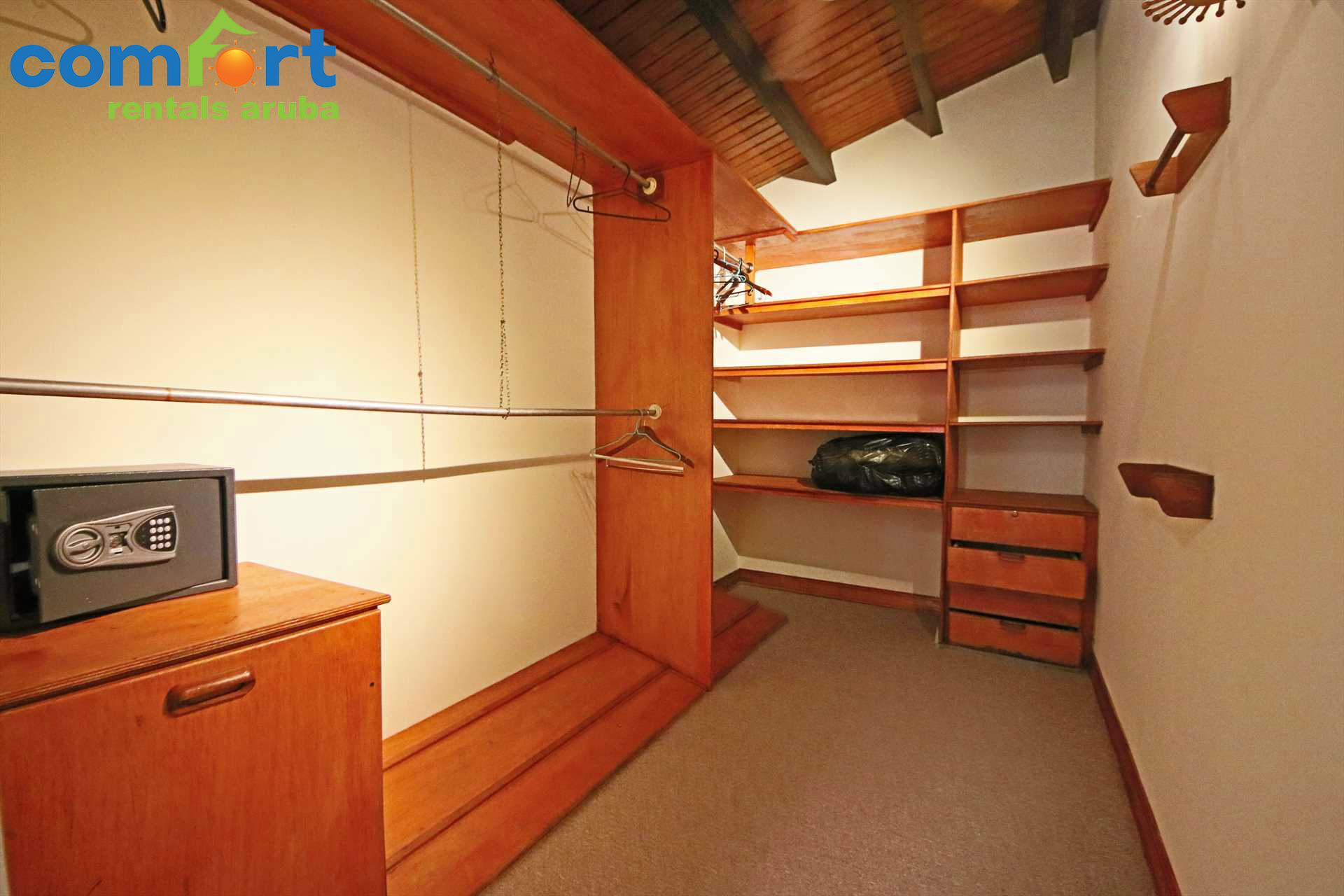 Walk-in closet with a safe in the master bedroom